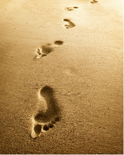 A photo of footprints in the sand